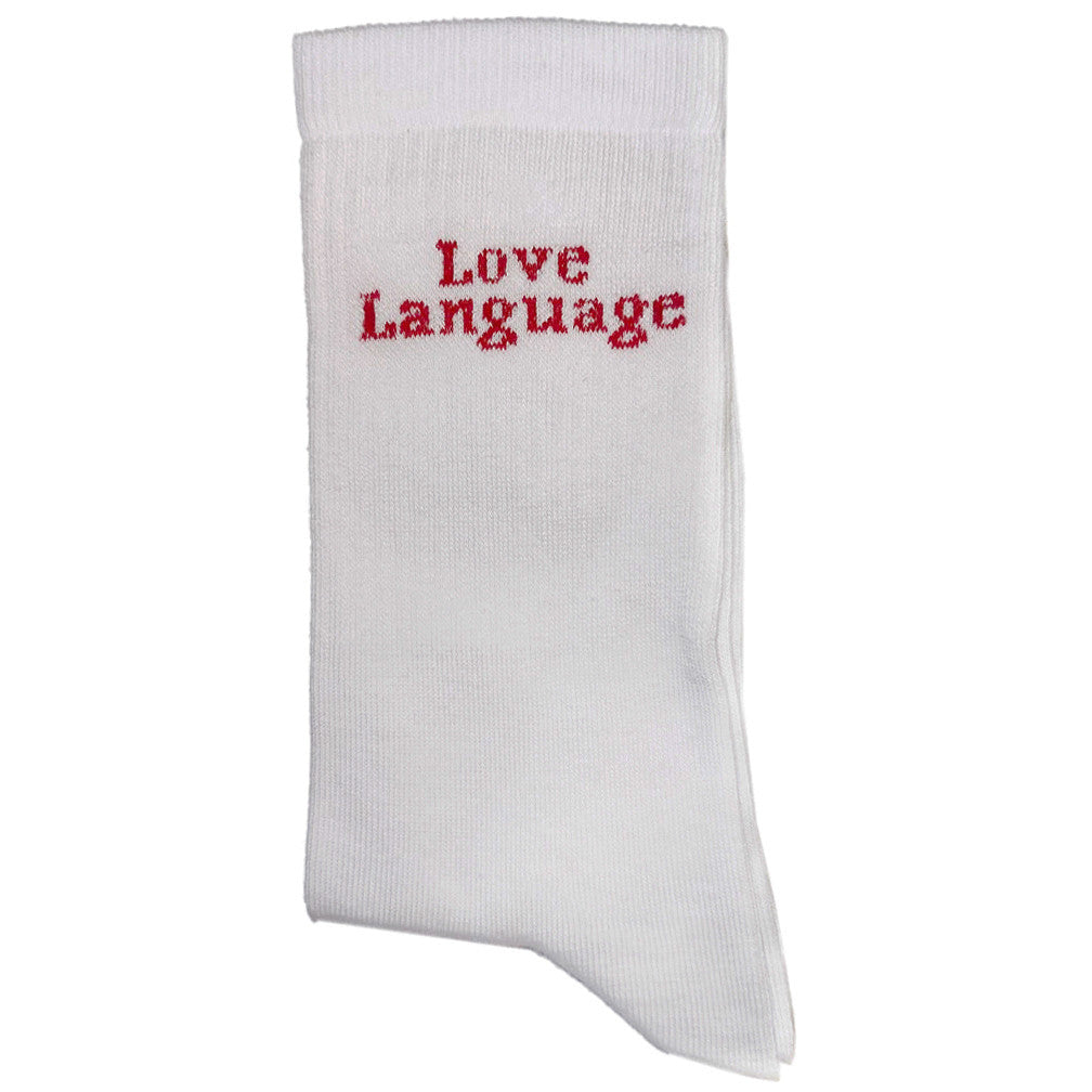 White sporty socks with “Love Language” printed in bold red, a collaboration between Socksat and Amar Attire.