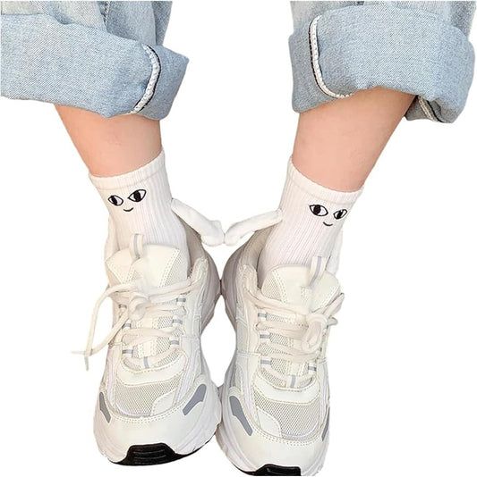 White socks with a Magnetic Hand in Hand design, symbolizing love and connection.