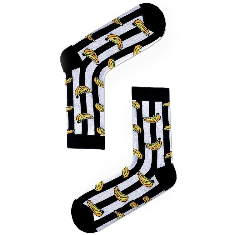 Black and white striped socks with yellow bananas, fun and quirky design.