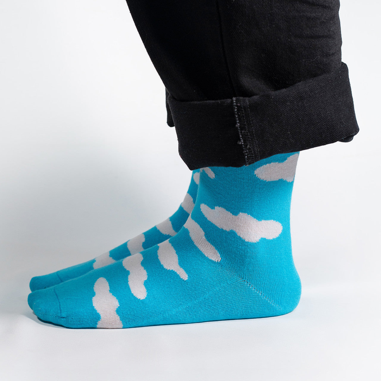 Float into the serene beauty of the sky with our White Clouds on Sky Blue Socks. These socks feature a dreamy pattern of fluffy white clouds against a calming sky blue backdrop, creating a tranquil and picturesque design.
Crafted for comfort and style, these socks are a breath of fresh air for your wardrobe. Whether you're strolling through the city or daydreaming in the countryside, our White Clouds on Sky Blue Socks are the perfect companion for an added touch of whimsy.
Step into the tranquility of the
