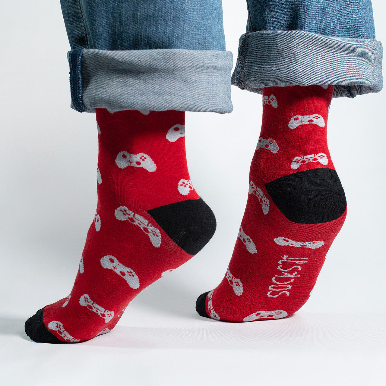 Red socks featuring gaming joysticks, perfect for gamers and gaming enthusiasts.
Whether you're conquering virtual worlds or just want to showcase your gaming spirit, our Joystick Controllers Icons Socks are the perfect accessory. Step into the world of pixels and play – order your pair today and let your socks reflect your passion for the gaming universe!