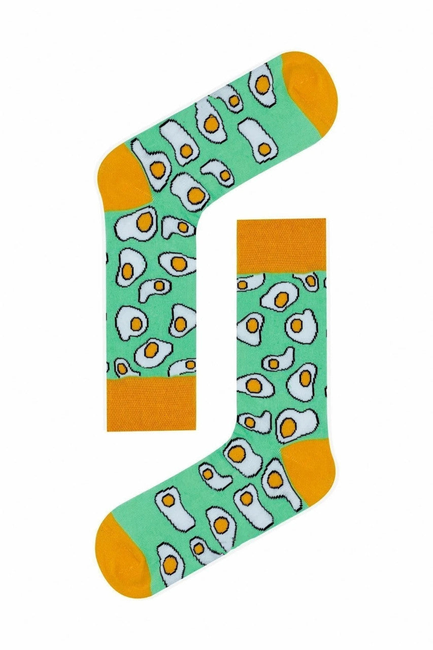 Green socks with yellow toes and a sunny side up eggs print.