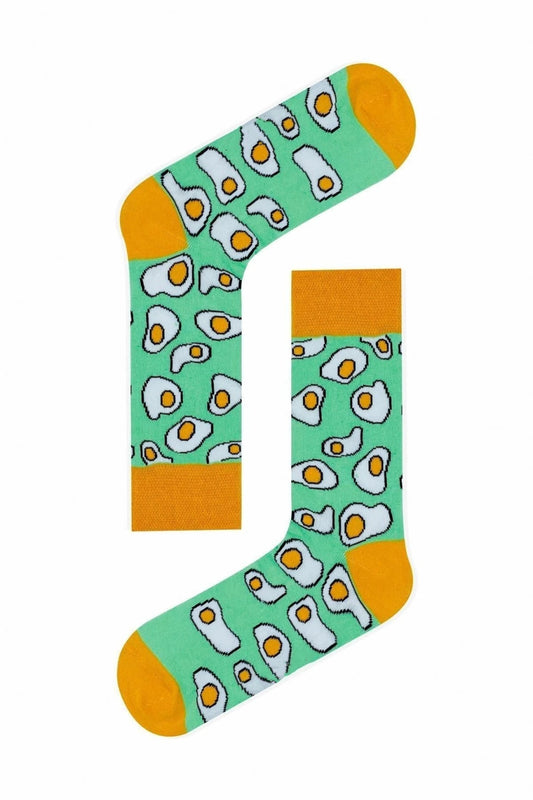 Green socks with yellow toes and a sunny side up eggs print.