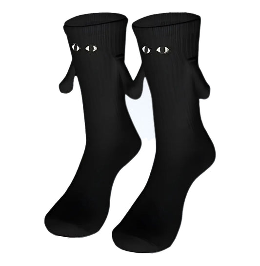 Black socks with a Magnetic Hand in Hand design, symbolizing love and connection.