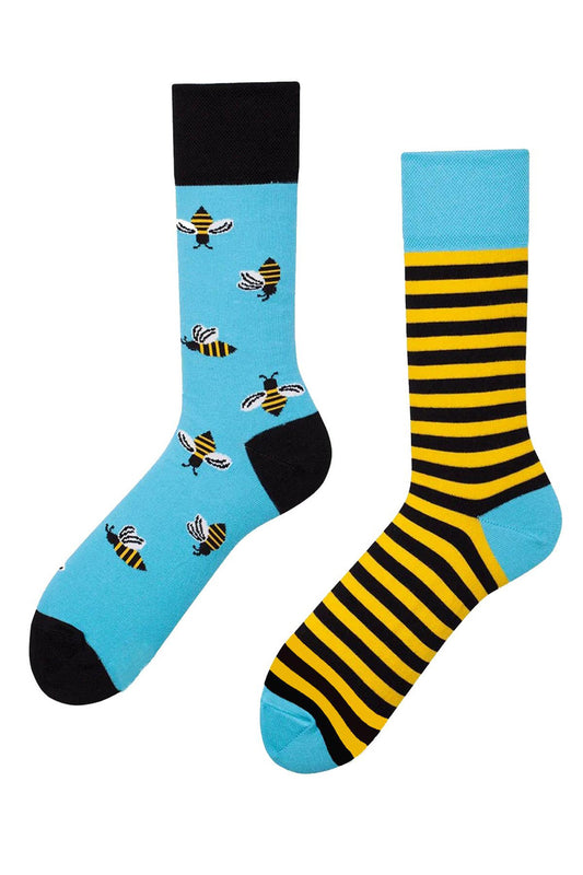 Mismatched socks with bee designs, fun and playful honeybee-themed socks.