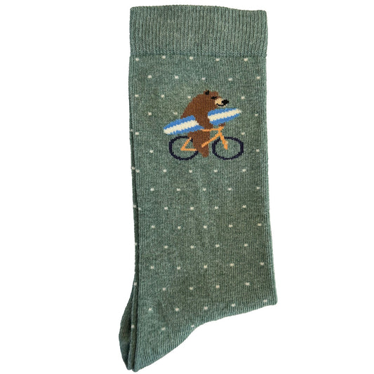 Green socks featuring a bear riding a bicycle and holding a surfboard in a fun and whimsical design.