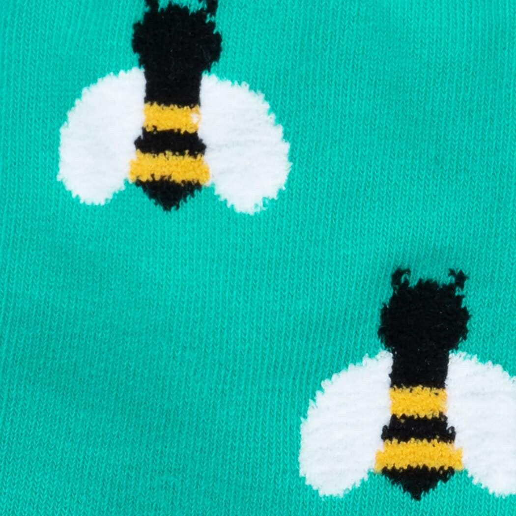 Oh, bees. How can we ever show our appreciation for all that they do for our planet? We hope they'd accept our humble offering of these socks, upon which we wove super fuzzy and adorable bees. It's kind of like you're the flower when you wear them, and that's fitting because you're beautiful and make us smile. No wonder these bees love you!