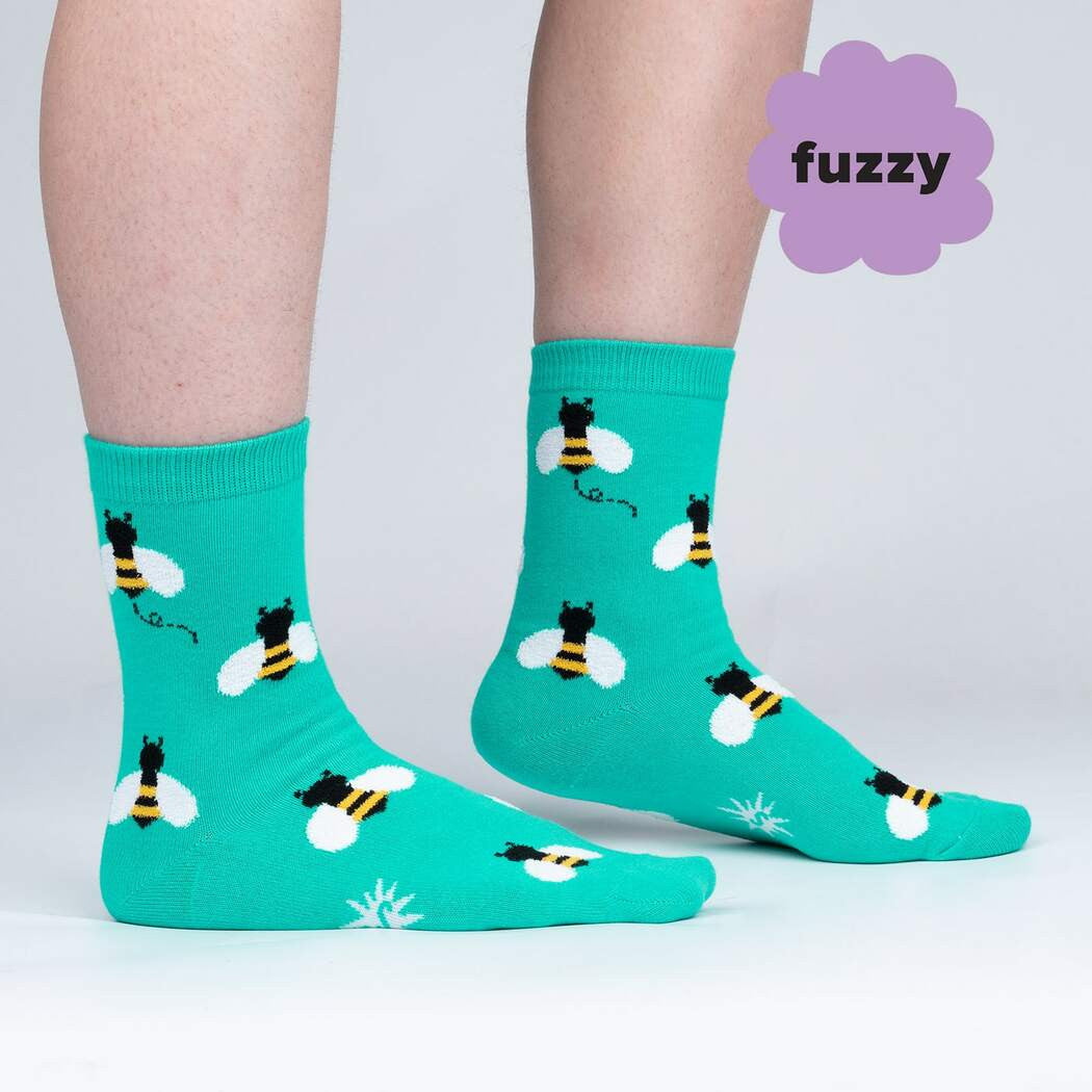 Oh, bees. How can we ever show our appreciation for all that they do for our planet? We hope they'd accept our humble offering of these socks, upon which we wove super fuzzy and adorable bees. It's kind of like you're the flower when you wear them, and that's fitting because you're beautiful and make us smile. No wonder these bees love you!
