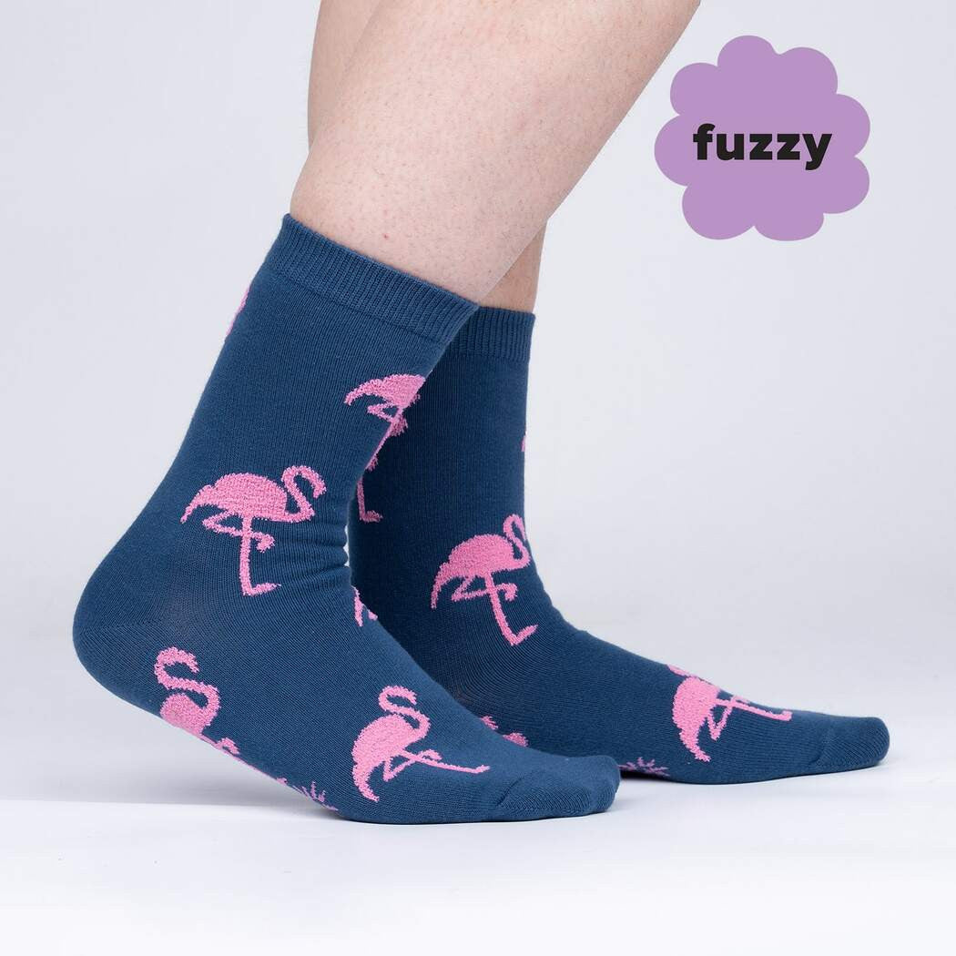 Did you know flamingos aren't born pink? They're born with whitish feathers, and turn pink from the algae and crustaceans they eat. It's hard to say definitively why they stand on one foot, but that pose and their famous coloring make them instantly recognizable creatures. We had to illustrate them for ourselves, and make a sock that'll flamin-go with you anywhere you like.