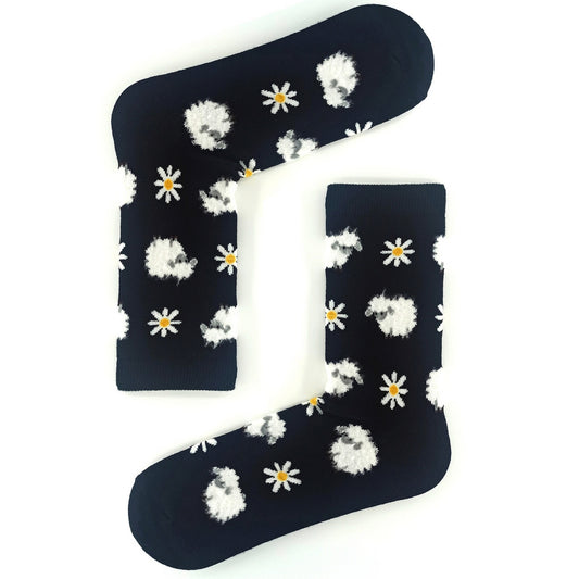 Black socks featuring a cute sheep and flower pattern, cozy and stylish.