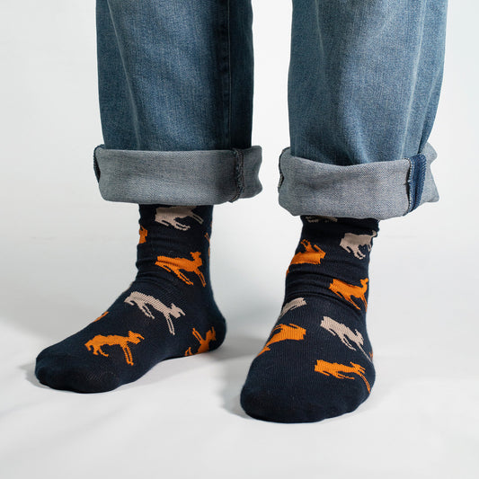 Stride into style with our Camel Pattern Socks on a navy background! These socks feature an elegant and charming pattern of camels, creating a unique and sophisticated design against a classic navy backdrop.

Crafted for comfort and flair, these socks are perfect for those who appreciate a touch of exotic charm in their wardrobe. Whether you're a camel enthusiast or simply looking to make a statement with your sock game, these socks are sure to add a dash of personality to your ensemble.

Step into the worl