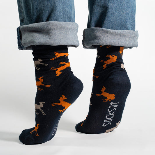 Stride into style with our Camel Pattern Socks on a navy background! These socks feature an elegant and charming pattern of camels, creating a unique and sophisticated design against a classic navy backdrop.

Crafted for comfort and flair, these socks are perfect for those who appreciate a touch of exotic charm in their wardrobe. Whether you're a camel enthusiast or simply looking to make a statement with your sock game, these socks are sure to add a dash of personality to your ensemble.

Step into the worl