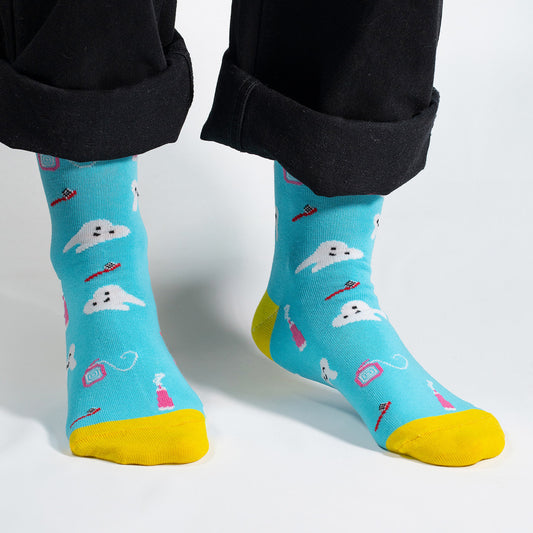 Step into dental style with our Dentist Icons Socks! Featuring a playful pattern of dental symbols like toothbrushes, toothpaste, and smiling teeth, these socks are a whimsical and charming addition to your wardrobe. Crafted for comfort and flair, these socks are perfect for dental professionals or anyone who wants to add a touch of dental charm to their outfit.

Whether you're heading to the dental office or just want to showcase your appreciation for oral health, our Dentist Icons Socks are a fun and uniq
