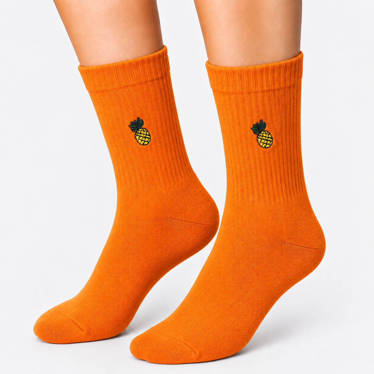 Orange crew socks with embroidered pineapple