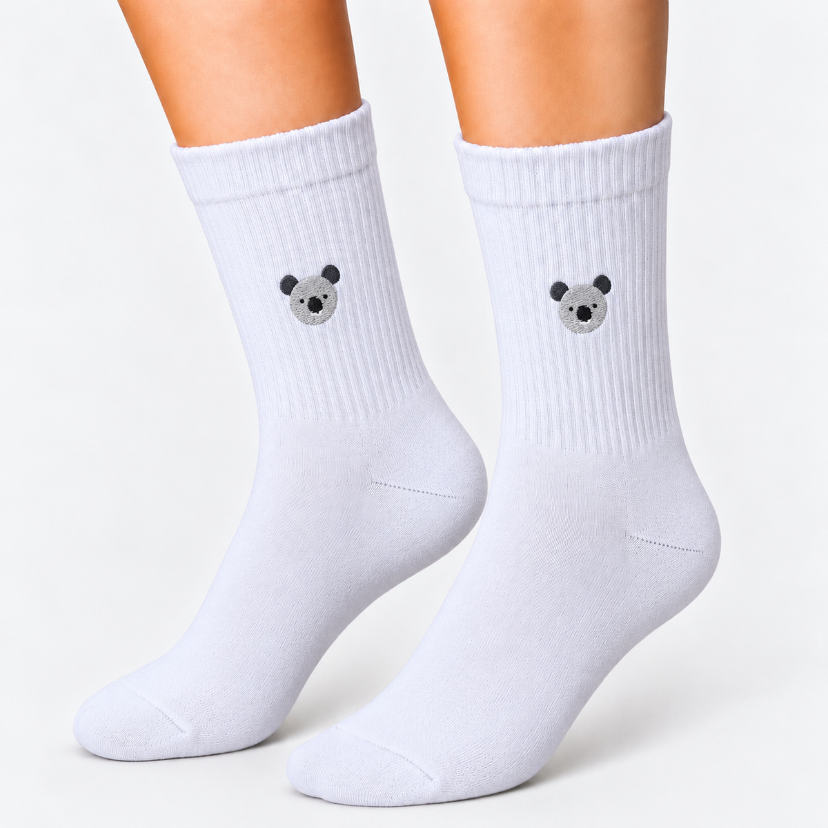 White sports socks with embroidered koala icon