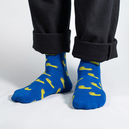 Introducing our whimsical Yellow Ducks on Blue Socks – the perfect blend of comfort and playfulness for your sock collection. Against a vibrant blue background, these socks feature adorable yellow rubber ducks, creating a charming and cheerful design.

Crafted for comfort and durability, our Yellow Ducks on Blue Socks bring a touch of nostalgia and fun to your everyday style. Whether you're a rubber duck enthusiast or simply looking for a quirky addition to your wardrobe, these socks are sure to make a spla