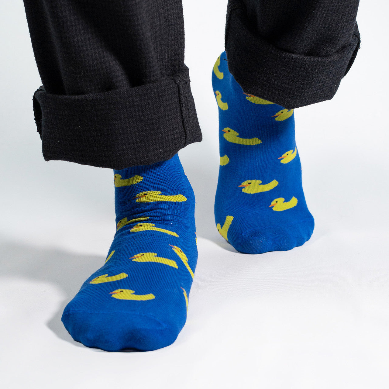 Introducing our whimsical Yellow Ducks on Blue Socks – the perfect blend of comfort and playfulness for your sock collection. Against a vibrant blue background, these socks feature adorable yellow rubber ducks, creating a charming and cheerful design.

Crafted for comfort and durability, our Yellow Ducks on Blue Socks bring a touch of nostalgia and fun to your everyday style. Whether you're a rubber duck enthusiast or simply looking for a quirky addition to your wardrobe, these socks are sure to make a spla