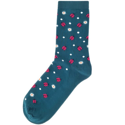 Teal socks with red ladybugs and white daisy flowers, playful and nature-inspired design.