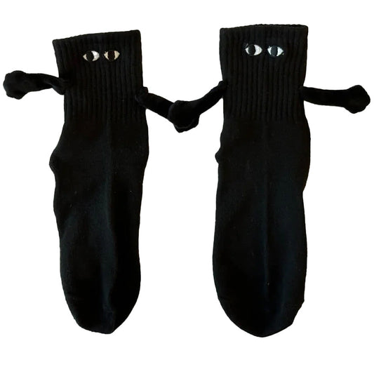 Black socks with a Magnetic Hand in Hand design, symbolizing love and connection.