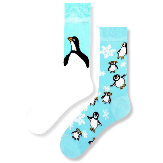 Mismatched blue socks with penguins, polar bears, and arctic animals – cozy unisex winter socks.