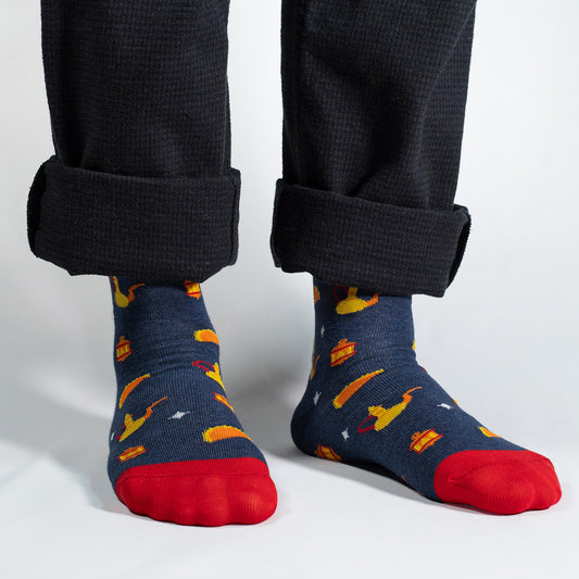 Elevate your Ramadan celebrations with our exclusive Ramadan Treats Socks. Against a rich navy background, these socks feature enchanting Ramadan fanous lanterns and atayef, creating a festive and stylish design that captures the spirit of the season.

Crafted with comfort in mind, these socks are the perfect addition to your Ramadan wardrobe. Whether you're attending iftar gatherings or celebrating with family, our Ramadan Treats Socks add a touch of warmth and style to your ensemble.

Celebrate the joy of