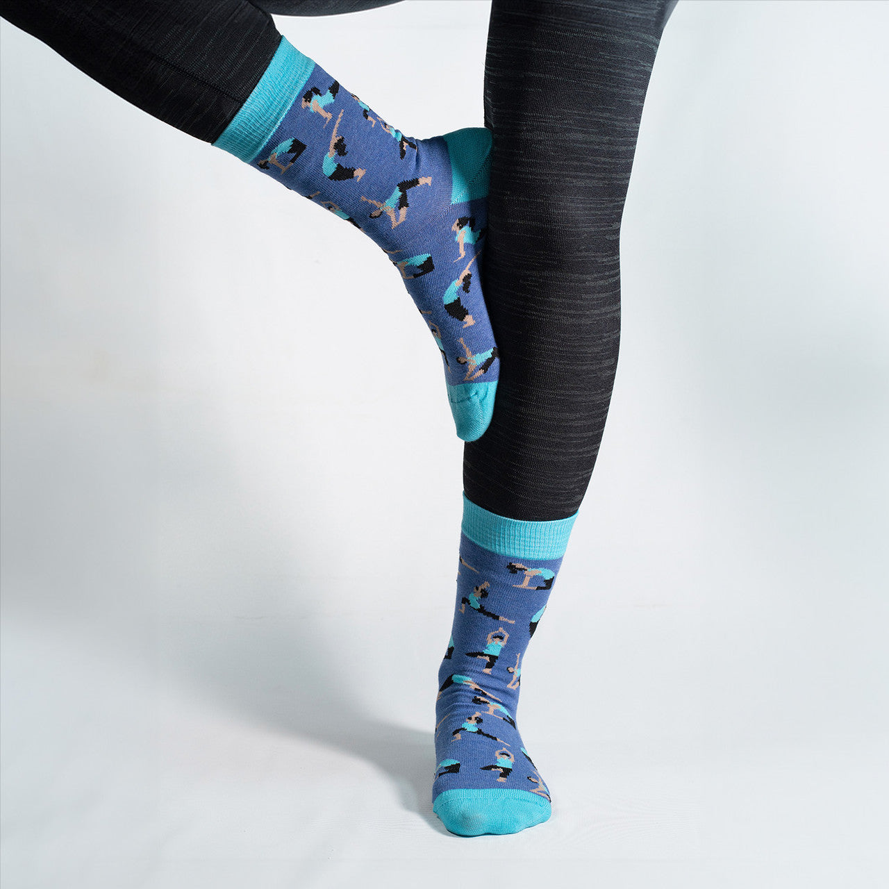 Elevate your zen with our Yoga Poses Socks! Featuring a dynamic pattern of various yoga poses, these socks are designed to bring balance and comfort to your every step. Crafted for both style and flexibility, these socks are perfect for yoga enthusiasts or anyone looking to add a touch of mindfulness to their wardrobe.

Whether you're heading to the studio or simply embracing a more mindful lifestyle, our Yoga Poses Socks are a perfect addition to your sock collection. Step into serenity and style – order y